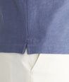Model is wearing UNTUCKit Blue Indigo Cotton Slub Resort Shirt.
