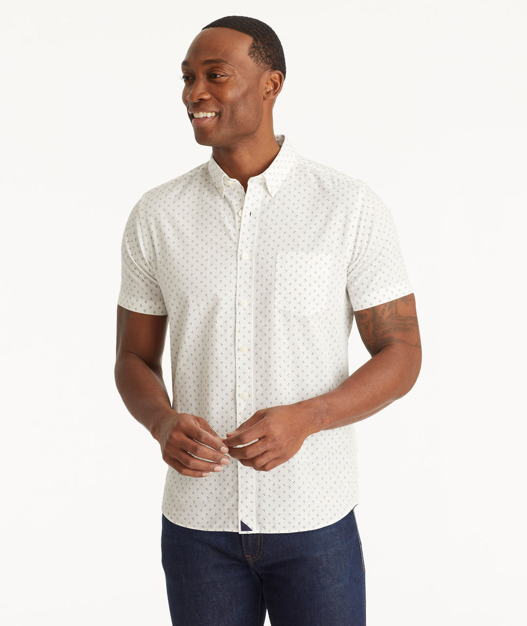Model wearing an UNTUCKit White Cotton Printed Short-Sleeve Logan Shirt