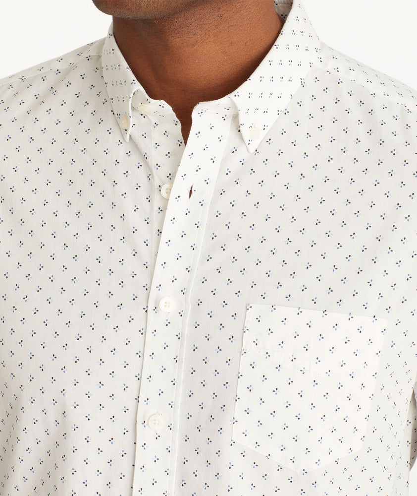 Model wearing an UNTUCKit White Cotton Printed Short-Sleeve Logan Shirt