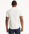 Model wearing an UNTUCKit White Cotton Printed Short-Sleeve Logan Shirt