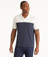 Model wearing an UNTUCKit Navy No Sweat Polo with Colorblock