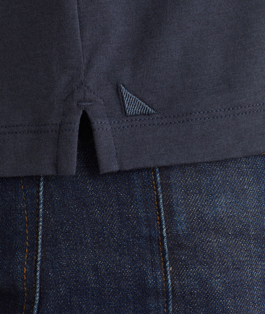 Model wearing an UNTUCKit Navy No Sweat Polo with Colorblock
