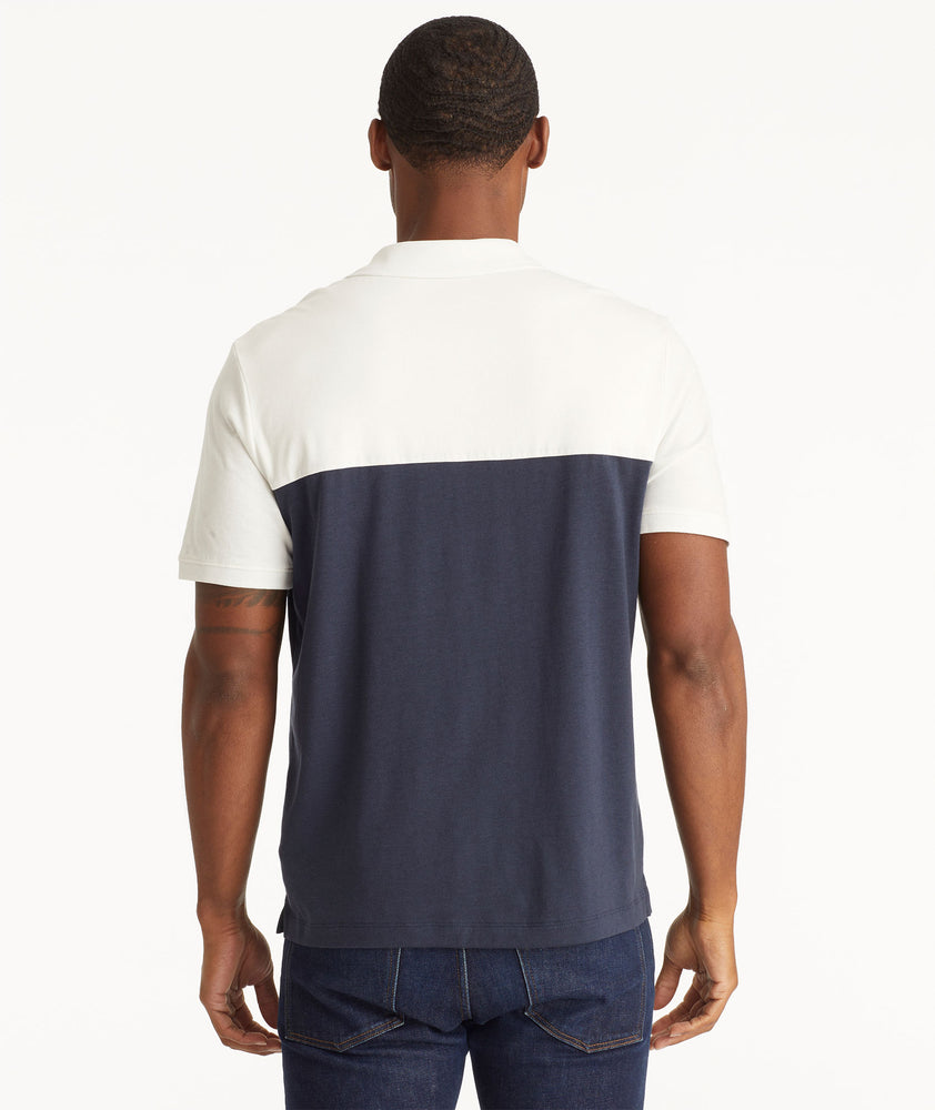 Model wearing an UNTUCKit Navy No Sweat Polo with Colorblock