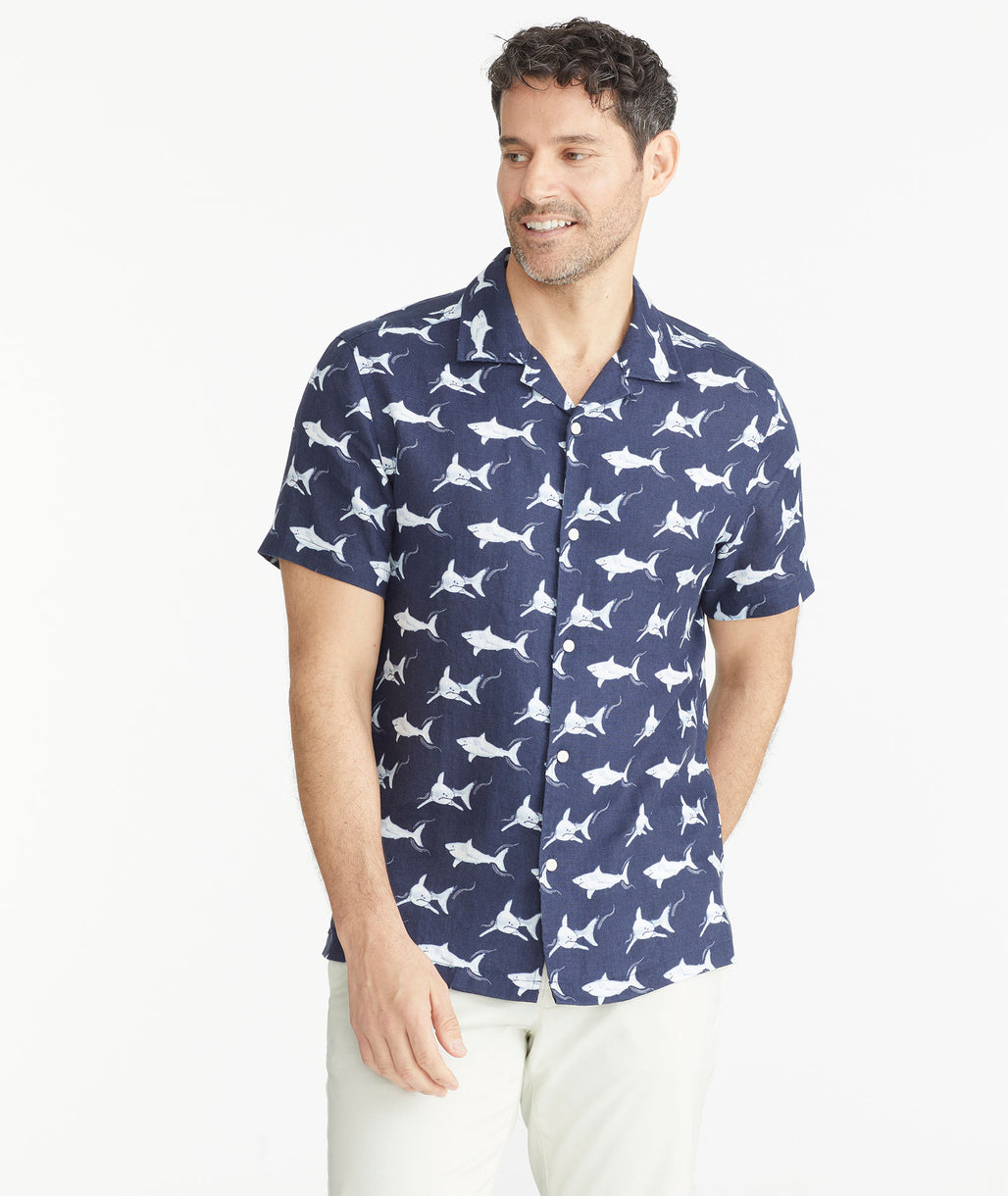 Model is wearing a David Hart x UNTUCKit Shark Print Linen Short-Sleeve Shirt.
