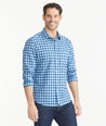 Model is wearing UNTUCKit Light Blue & Navy Gingham Wrinkle-Free Mariano Shirt.