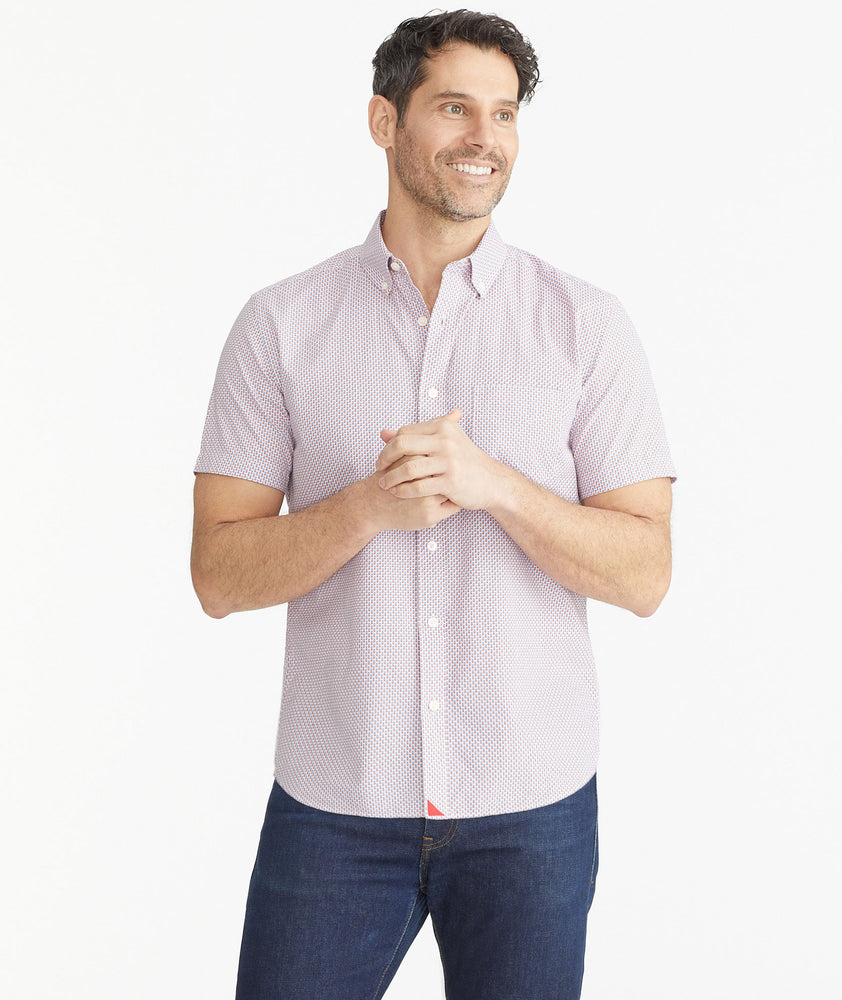 Model is wearing UNTUCKit Micro Red White & Blue Check Cotton Short-Sleeve Mayfield Shirt.