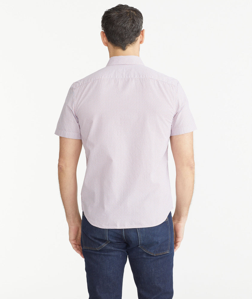 Model is wearing UNTUCKit Micro Red White & Blue Check Cotton Short-Sleeve Mayfield Shirt.