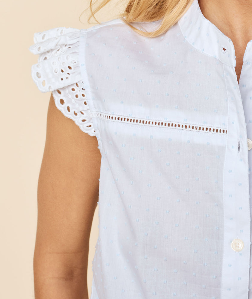 Model is wearing UNTUCKit white and blue Flutter Sleeve Cotton Clip Dot Meg Shirt.