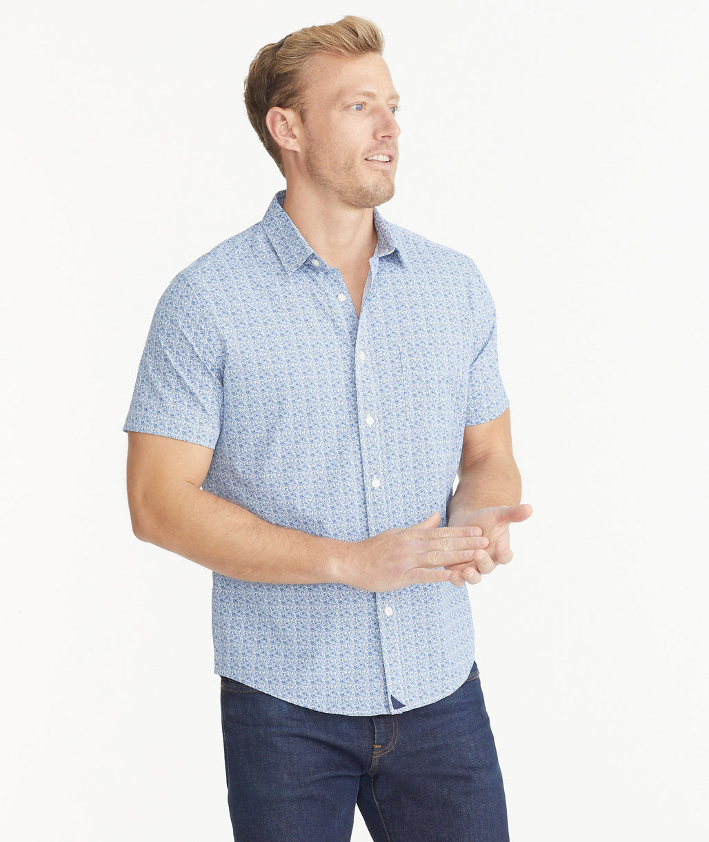 Model is wearing UNTUCKit Grapefruit Print Wrinkle-Free Performance Short-Sleeve Mondello Shirt.