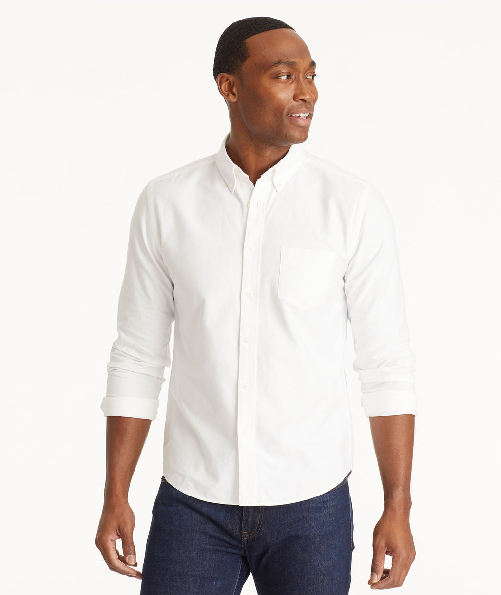 Model wearing an UNTUCKit White Oxford Picardan Shirt