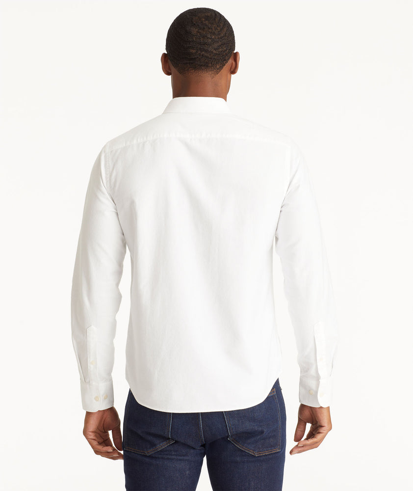 Model wearing an UNTUCKit White Oxford Picardan Shirt