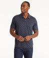 Model wearing an UNTUCKit Navy No Sweat Polo with Pattern