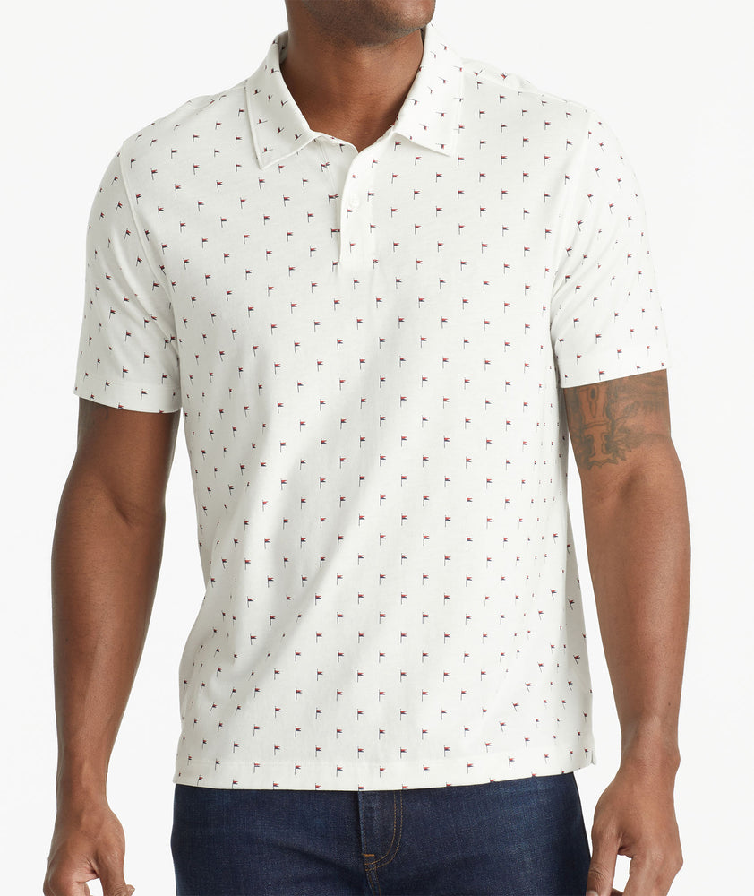 Model wearing an UNTUCKit White No Sweat Polo with Pattern