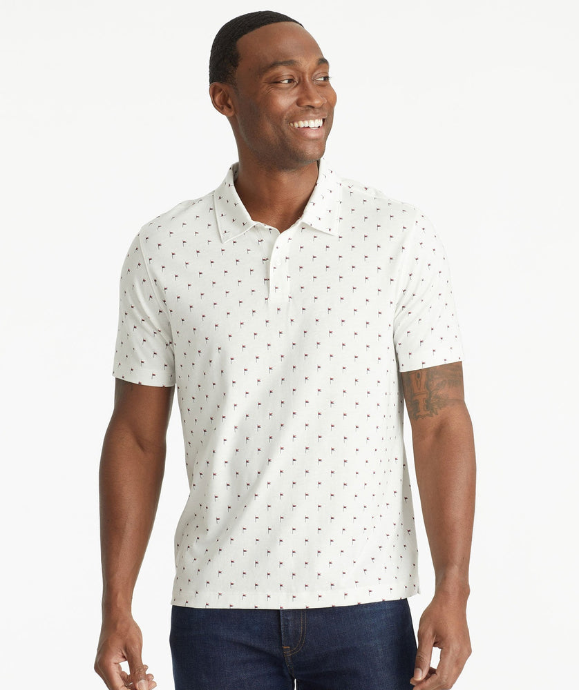 Model wearing an UNTUCKit White No Sweat Polo with Pattern