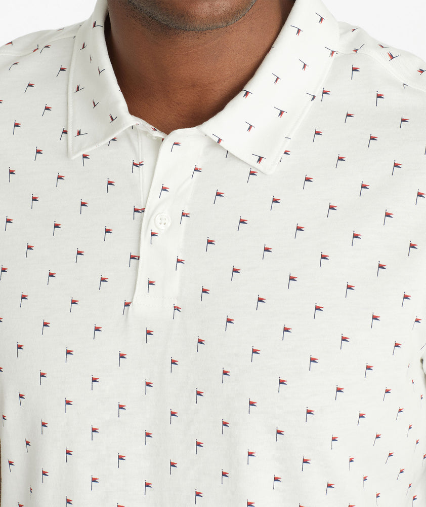 Model wearing an UNTUCKit White No Sweat Polo with Pattern