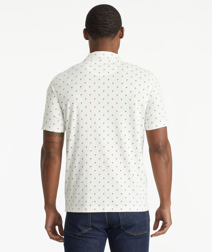Model wearing an UNTUCKit White No Sweat Polo with Pattern