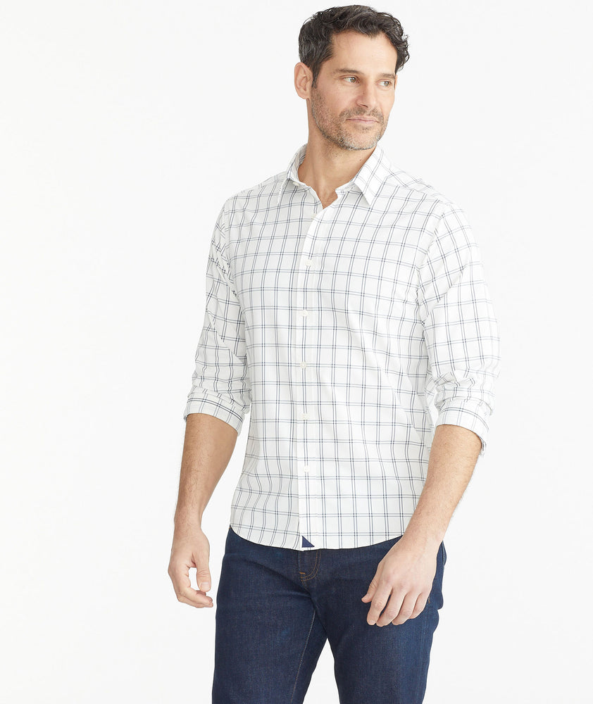 Model wearing a UNTUCKit white Wrinkle-Free Performance Tayson Shirt
