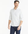 Model wearing a UNTUCKit white Wrinkle-Free Performance Tayson Shirt