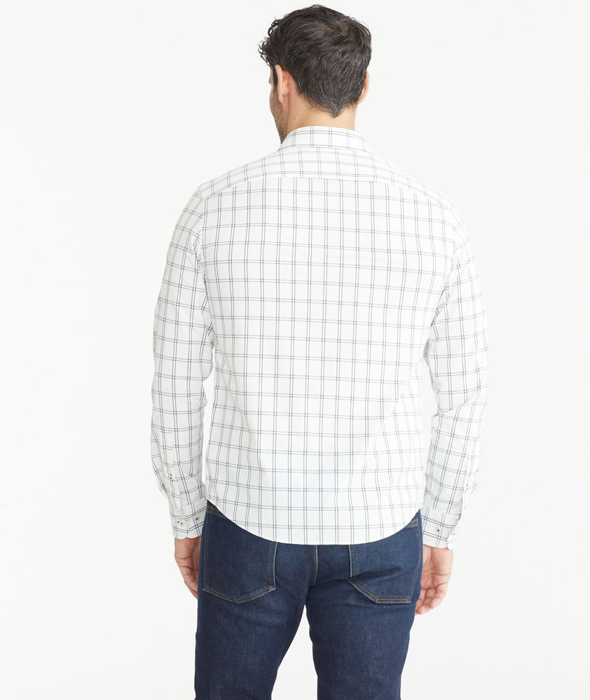 Model wearing a UNTUCKit white Wrinkle-Free Performance Tayson Shirt