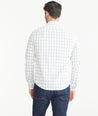 Model wearing a UNTUCKit white Wrinkle-Free Performance Tayson Shirt