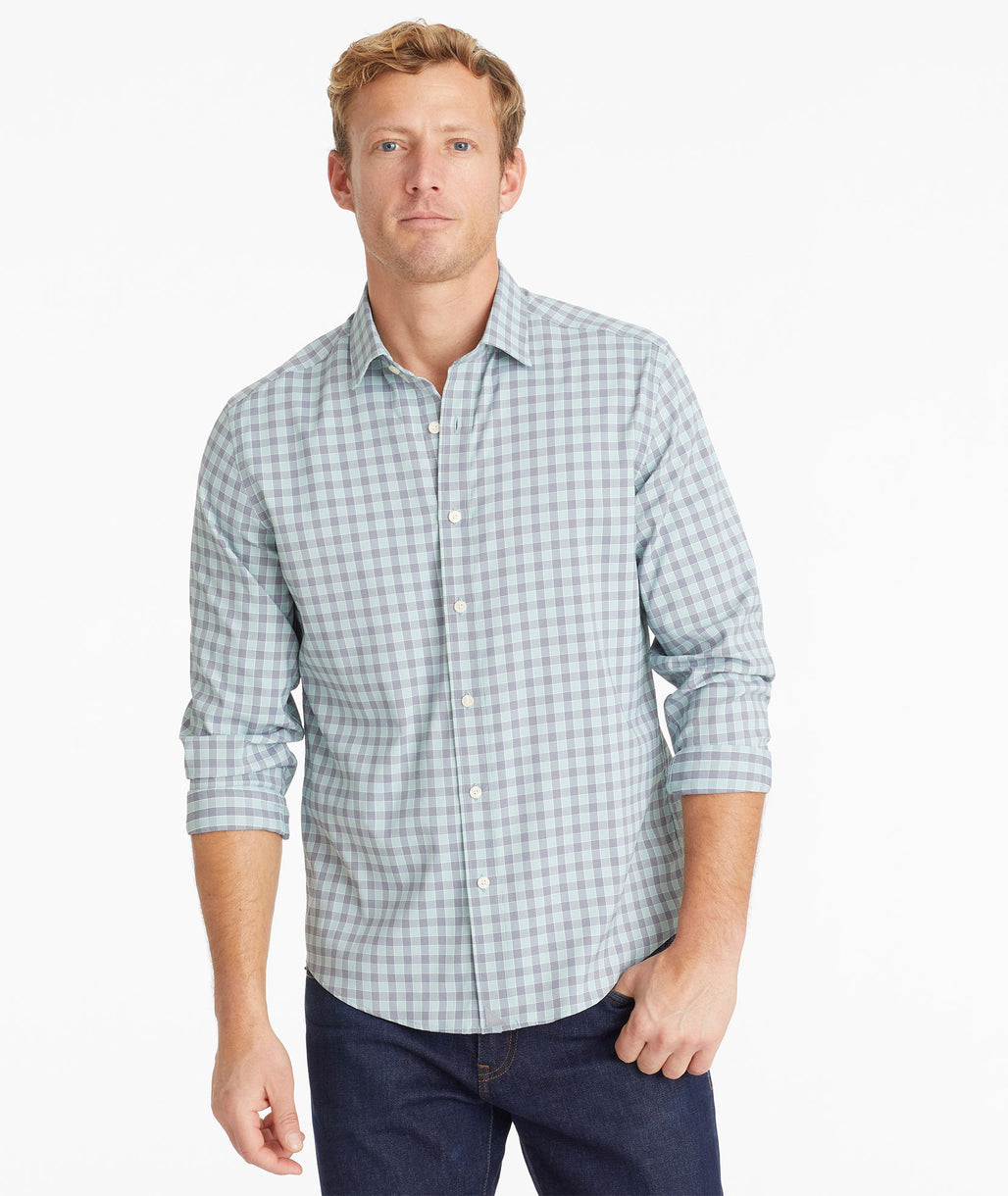 Model wearing an UNTUCKit Light Green Wrinkle-Free Performance Tokay Shirt