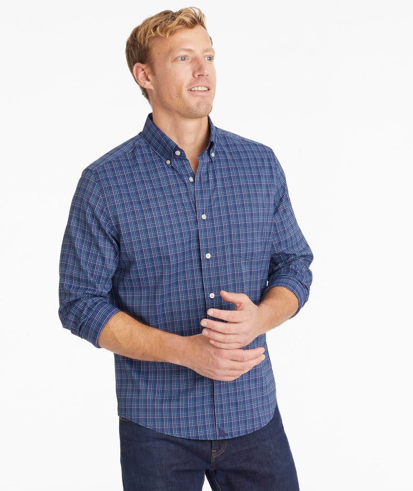 Model wearing an UNTUCKit Navy Wrinkle-Free Performance Vesparo Shirt