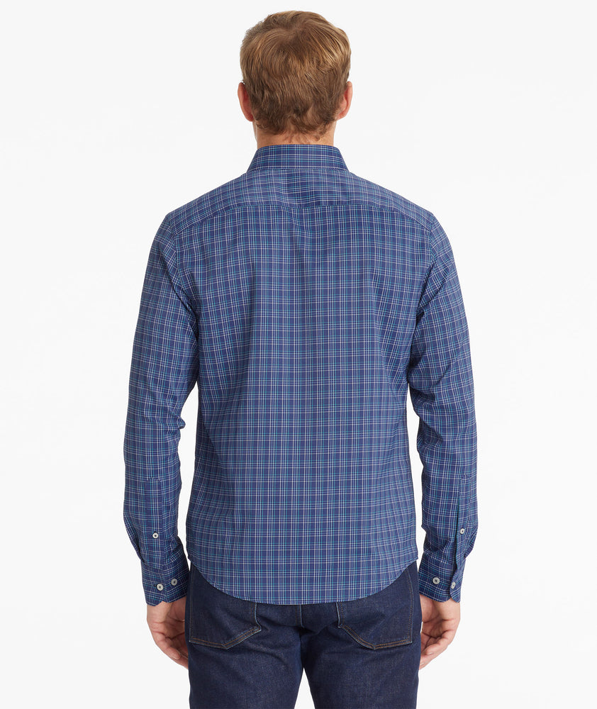 Model wearing an UNTUCKit Navy Wrinkle-Free Performance Vesparo Shirt