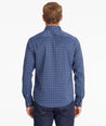 Model wearing an UNTUCKit Navy Wrinkle-Free Performance Vesparo Shirt