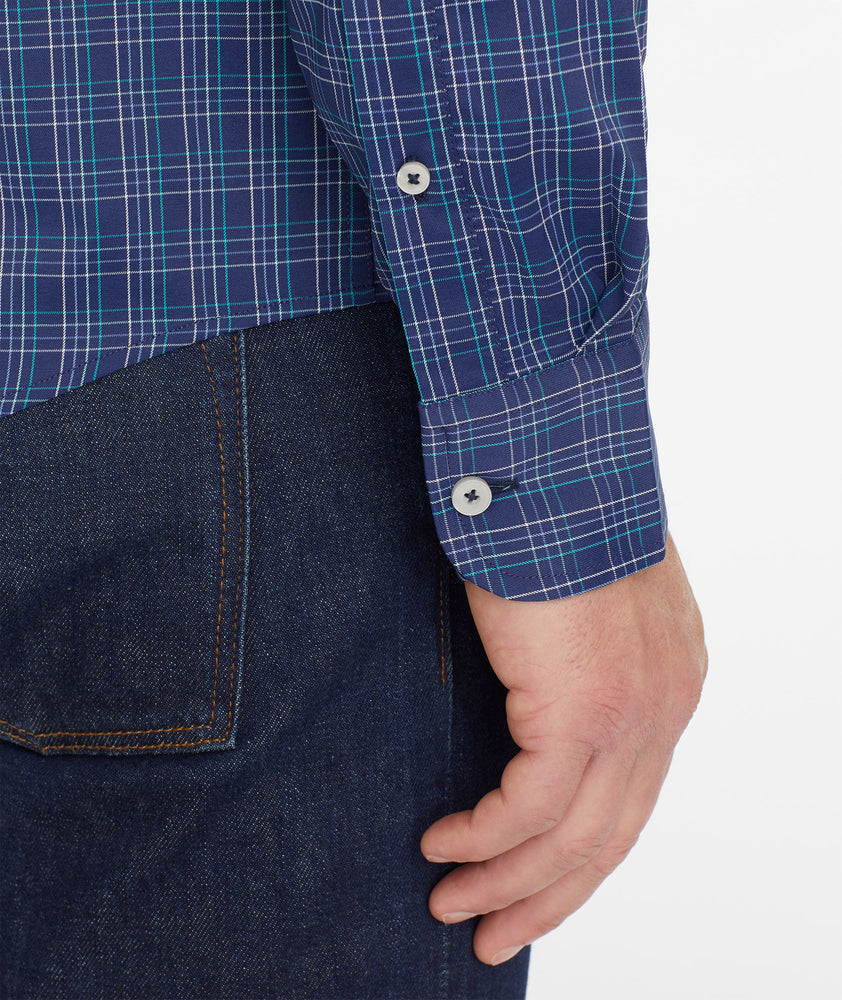 Model wearing an UNTUCKit Navy Wrinkle-Free Performance Vesparo Shirt