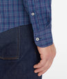 Model wearing an UNTUCKit Navy Wrinkle-Free Performance Vesparo Shirt