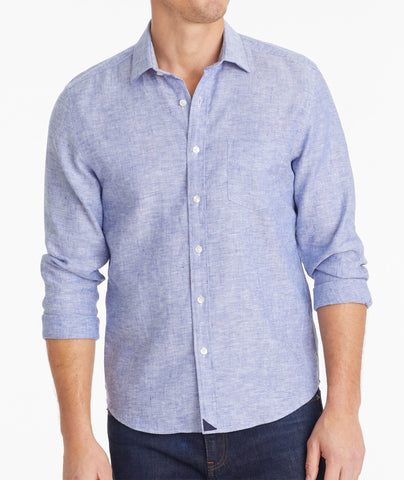 Model wearing an UNTUCKit Mid Blue Wrinkle-Resistant Linen Vin Santo Shirt