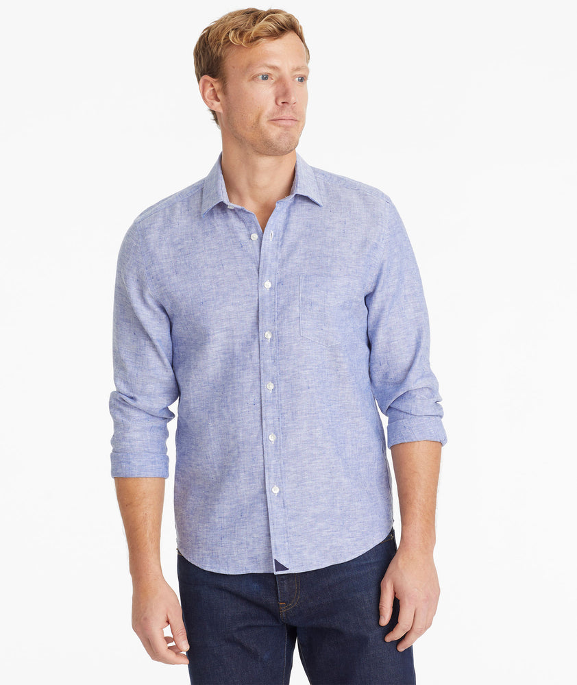Model wearing an UNTUCKit Mid Blue Wrinkle-Resistant Linen Vin Santo Shirt