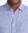 Model wearing a Blue Wrinkle-Resistant Linen Vin Santo Shirt